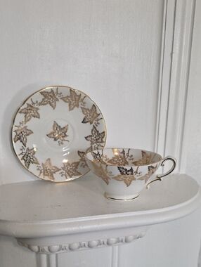 vintage Stanley Bone China teacup and saucer set featuring a gold maple leaf